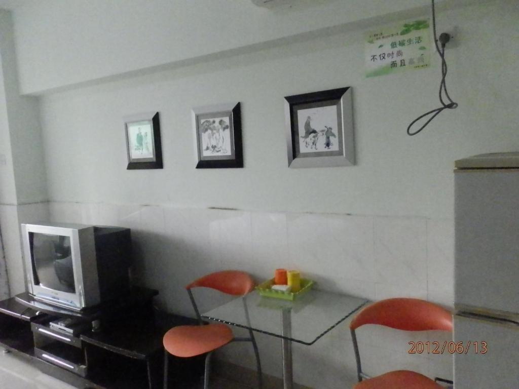 Xingfu Hotel Нанинг Стая снимка
