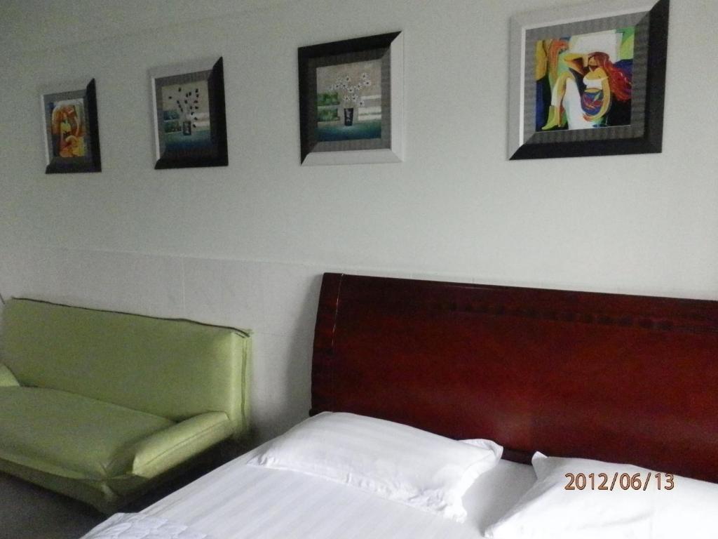 Xingfu Hotel Нанинг Стая снимка
