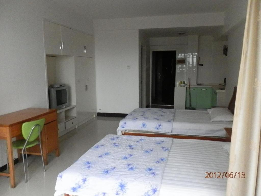Xingfu Hotel Нанинг Стая снимка